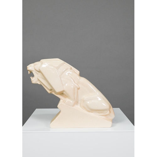 439 - An Art Deco Ashtead Pottery roaring lion on wedge plinth, 19 x 22 cm (cracked)