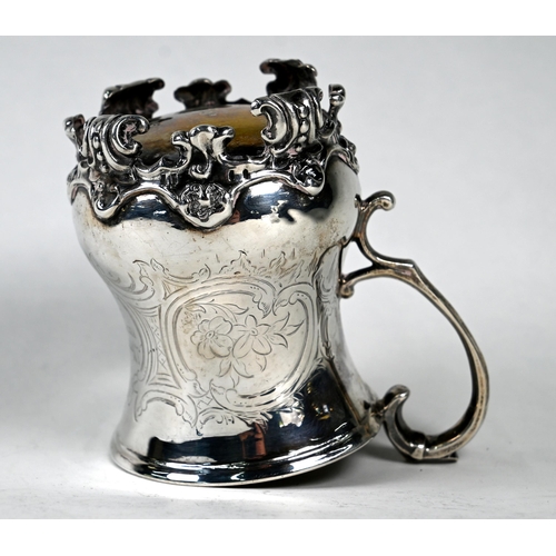44 - A Victorian silver baluster half-pint mug with scroll handle, engraved decoration and scrolling feet... 
