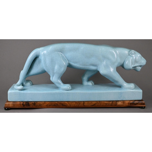 444 - An L&V Ceram large turquoise-glazed stalking tiger with overall crackle finish, on rectangular b... 