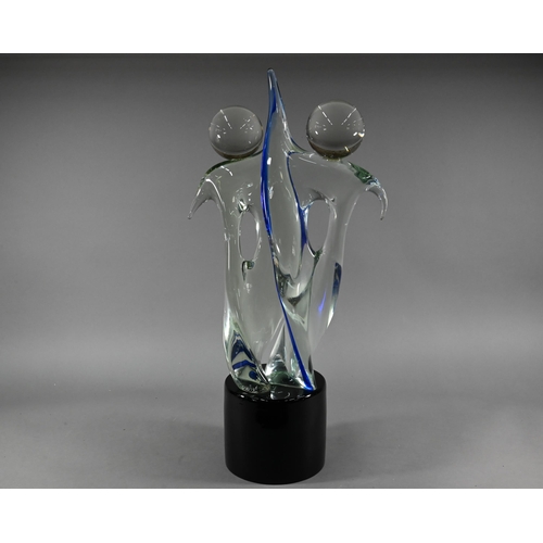 445 - A large Stefano Toso Murano glass group, dancing couple, on cylindrical black glass plinth, 77 cm hi... 