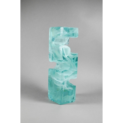 451 - A mottled green glass block, cast with 'Greek key' form, unsigned, 27 cm high