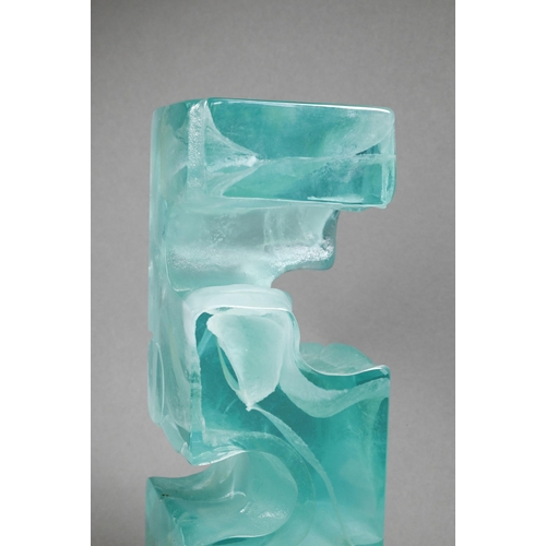 451 - A mottled green glass block, cast with 'Greek key' form, unsigned, 27 cm high