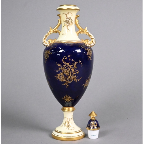 452 - A Coalport small china baluster vase and cover, painted with 'Loch Awe', signed E. D. Ball, on a blu... 