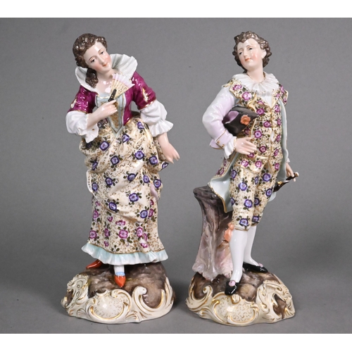 453 - A pair of Richard Eckhart & Co. (Volkstedt) porcelain figures in floral-painted costume, 21 cm, ... 