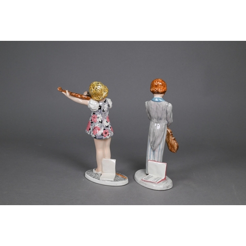 455 - A Goldscheider with Myott Son & Co. pottery group of three boys striding, 23 cm high, to/w two o... 