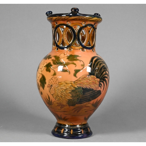 459 - A Hungarian Zsolnay (Pecs) pottery puzzle-jug, painted with a cockerel among shrubbery, with pierced... 