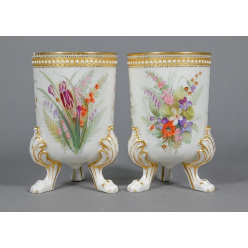 462 - A pair of opaque cream glass spill-vases, finely-painted with floral sprays and with gilded jewellin... 