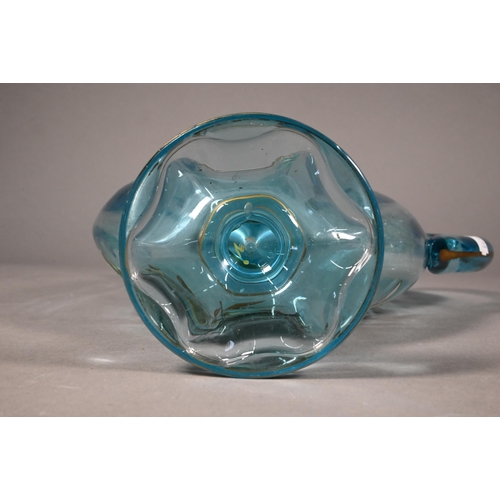 477 - A Continental blue glass jug of flattened form, painted with a bird in flight amongst foliage, 29 cm... 