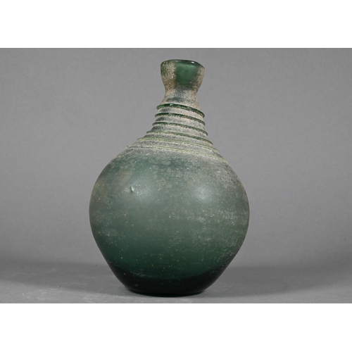 485 - A Middle Eastern glass vessel in the antiquity manner, of globular form, the narrow neck and shoulde... 