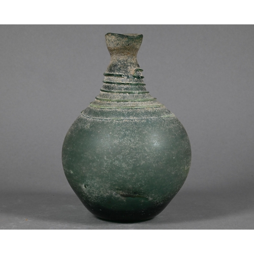 485 - A Middle Eastern glass vessel in the antiquity manner, of globular form, the narrow neck and shoulde... 