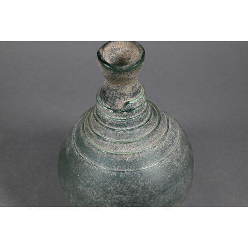 485 - A Middle Eastern glass vessel in the antiquity manner, of globular form, the narrow neck and shoulde... 