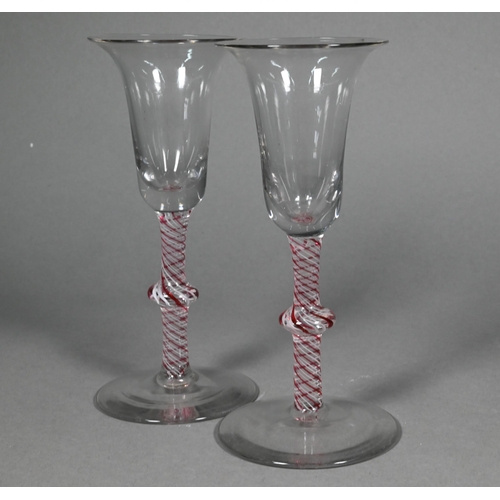 486 - A pair of cordial glasses in the 18th Century manner, with flared rims, two-colour opaque twist knop... 