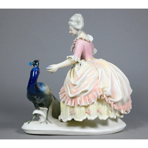 488 - A Karl Ens (Volkstedt) group - 18th century lady with peacock, 20 cm high