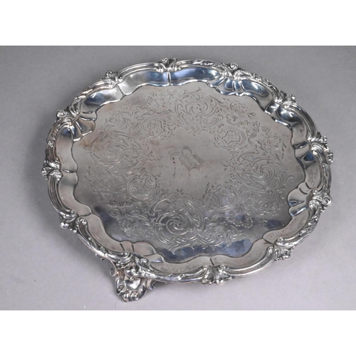 61 - Victorian silver salver with engraved decoration within foliate-moulded rim, on three scroll feet, G... 