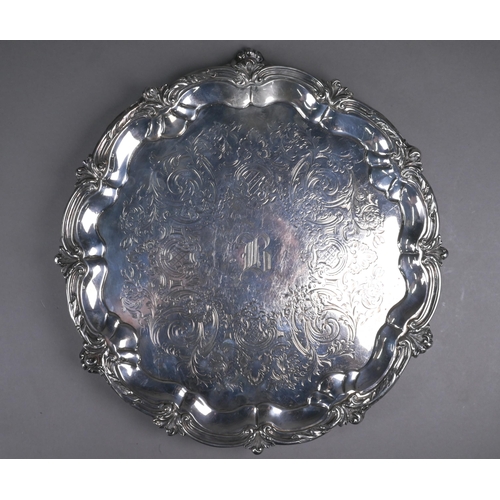 61 - Victorian silver salver with engraved decoration within foliate-moulded rim, on three scroll feet, G... 