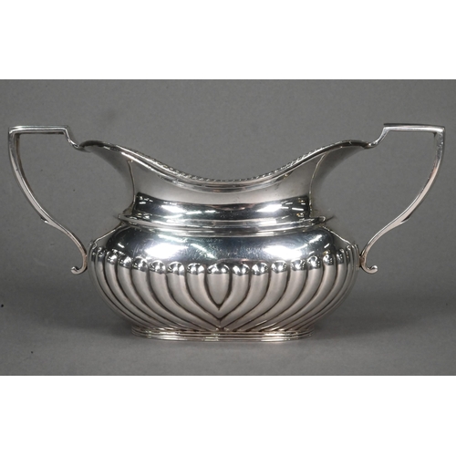 69 - A late Victorian half-reeded silver sugar basin with twin handles, Hawksworth Eyre & Co, London ... 