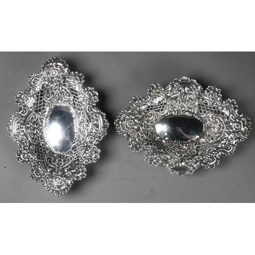 70 - A pair of Edwardian embossed and pierced silver bonbon dishes of lozenge form, Henry Matthews, Birmi... 