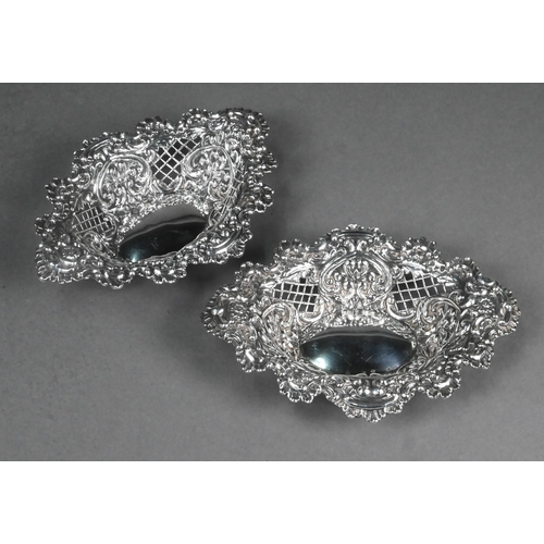 70 - A pair of Edwardian embossed and pierced silver bonbon dishes of lozenge form, Henry Matthews, Birmi... 