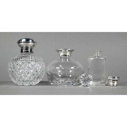 78 - Two globular cut glass cologne bottles with silver mounts, Sheffield/Birmingham 2000 to/w a smelling... 