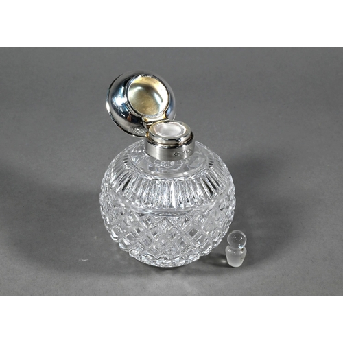 78 - Two globular cut glass cologne bottles with silver mounts, Sheffield/Birmingham 2000 to/w a smelling... 