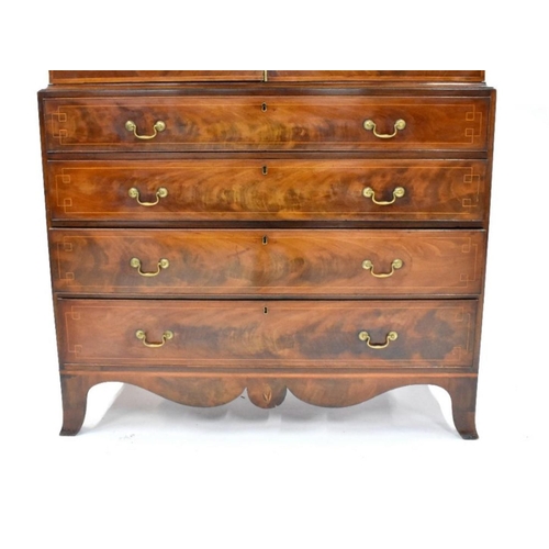 798 - A good Georgian satinwood and flame mahogany inlaid linen press, the dentil moulded cornice centred ... 