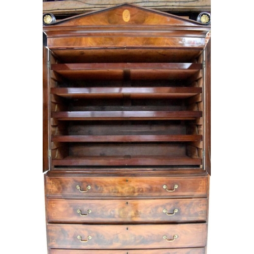 798 - A good Georgian satinwood and flame mahogany inlaid linen press, the dentil moulded cornice centred ... 