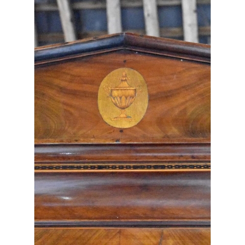 798 - A good Georgian satinwood and flame mahogany inlaid linen press, the dentil moulded cornice centred ... 