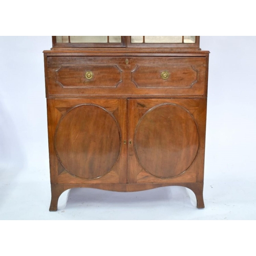 801 - A George III mahogany secretaire bookcase, the astragal glazed upper part two doors enclosing adjust... 