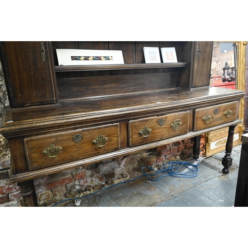 802 - An 18th century and later oak high dresser, with three drawers, raised on turned front legs, 190 cm ... 