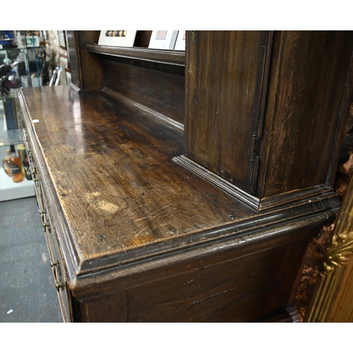 802 - An 18th century and later oak high dresser, with three drawers, raised on turned front legs, 190 cm ... 