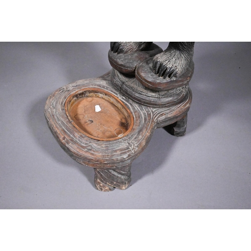 811 - A 19th century Black Forest carved bear stick stand, with glass eyes and open mouth, 86 cm h o/all