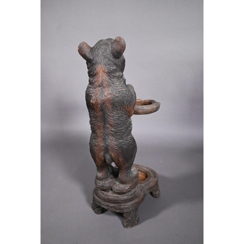 811 - A 19th century Black Forest carved bear stick stand, with glass eyes and open mouth, 86 cm h o/all