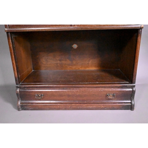 815 - An oak four section Globe Wernicke bookcase, with base drawer (one door missing), 87 cm x 176 cm h