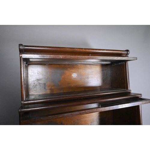 815 - An oak four section Globe Wernicke bookcase, with base drawer (one door missing), 87 cm x 176 cm h