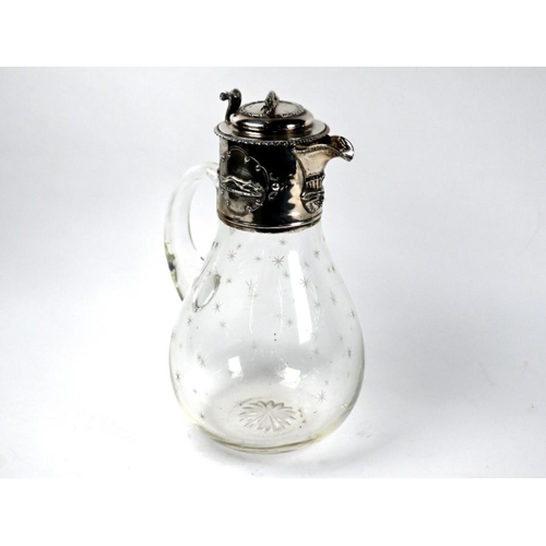 82 - A Victorian glass claret jug with star-cut decoration, the silver collar and cover surmounted and em... 