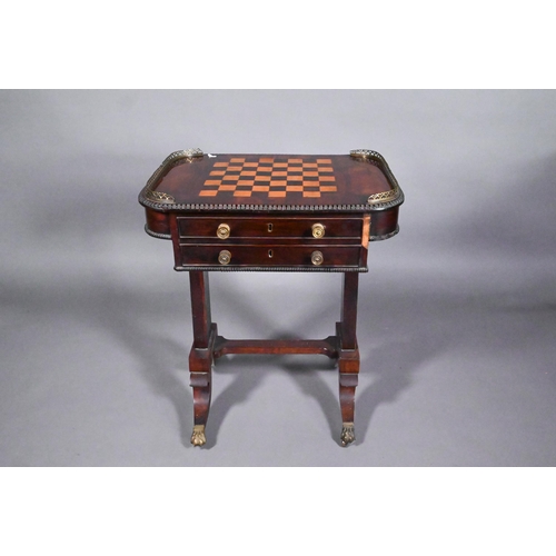 831 - A Regency rosewood games table, the chequerboard inset top flanked by pierced brass galleries to the... 