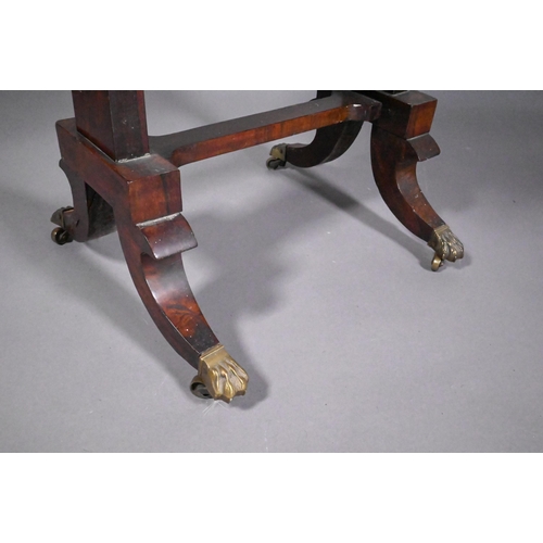 831 - A Regency rosewood games table, the chequerboard inset top flanked by pierced brass galleries to the... 