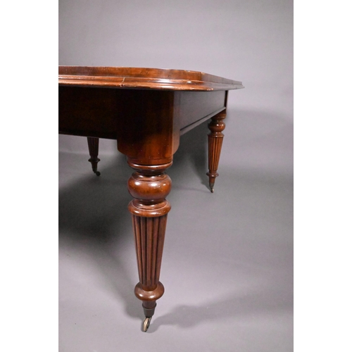 834 - A Victorian mahogany draw leaf extending dining table, raised on turned part gadrooned legs to brass... 