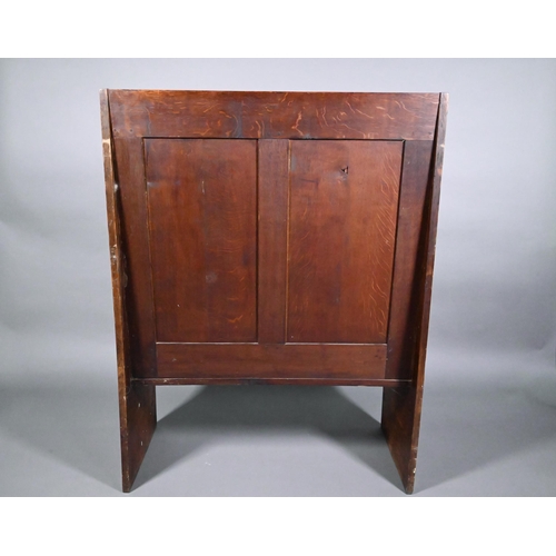 837 - A traditional oak high back settle with moulded back panels over shaped arms, 95 cm x 50 cm x 126 cm... 