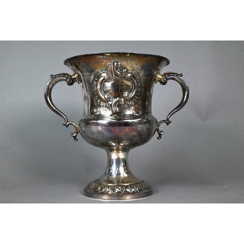 85 - A Victorian silver trophy cup of campana form with twin scroll handles, on stemmed and flared foot, ... 