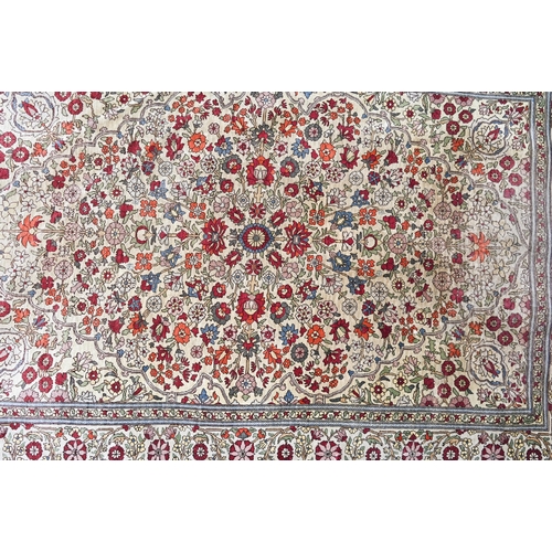 903 - A fine Turkish Hereke silk rug, the yellow/ochre ground centred by a floral medallion, 150 cm x 102 ... 