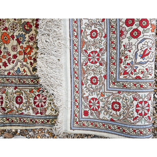 903 - A fine Turkish Hereke silk rug, the yellow/ochre ground centred by a floral medallion, 150 cm x 102 ... 