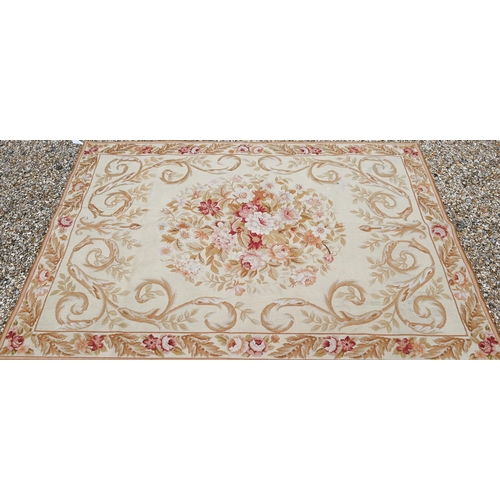 910 - Two traditionally executed Aubusson style floral decorated rugs, 182 cm x 122 cm and 180 cm x 120 cm