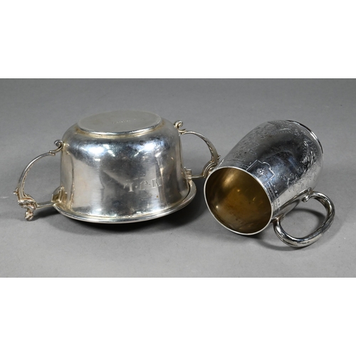 92 - A Victorian foliate-engraved silver Christening mug, London 1885 to/w a porringer, the twin handles ... 