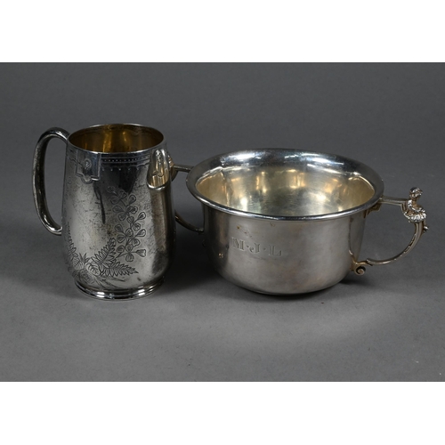 92 - A Victorian foliate-engraved silver Christening mug, London 1885 to/w a porringer, the twin handles ... 