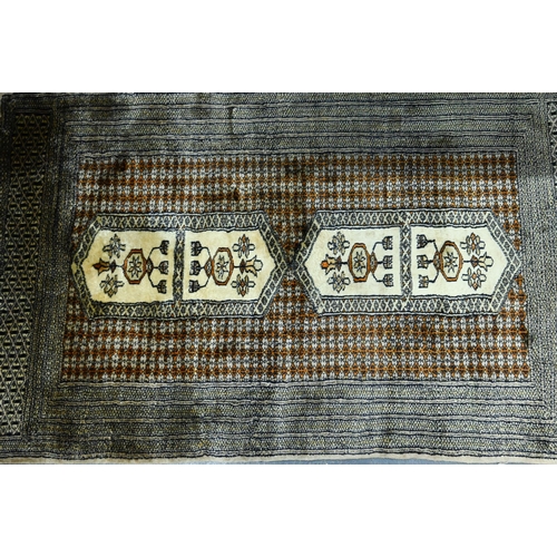 922 - A contemporary Turkoman style Afghan rug on camel ground, 156 x 94 cm