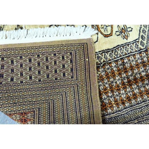 922 - A contemporary Turkoman style Afghan rug on camel ground, 156 x 94 cm