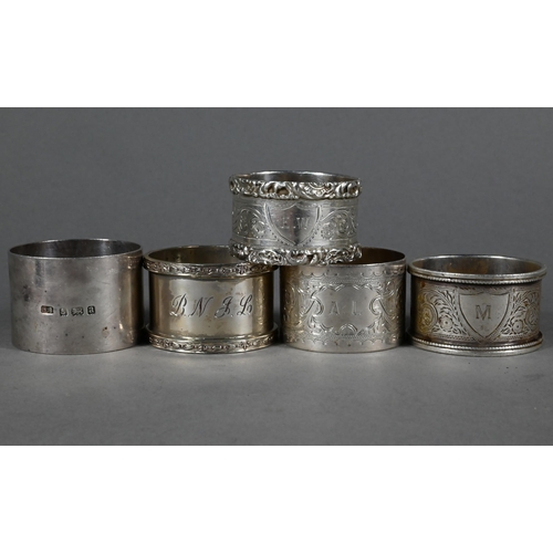 93 - Nine various silver napkin rings to/w a Port decanter label, miniature trophy cup and a cased set of... 