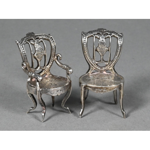 94 - Two late Victorian silver novelty miniature chairs, London import 1892, 4 cm high