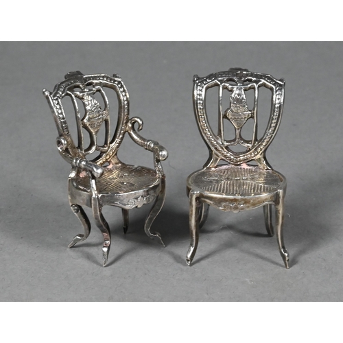 94 - Two late Victorian silver novelty miniature chairs, London import 1892, 4 cm high